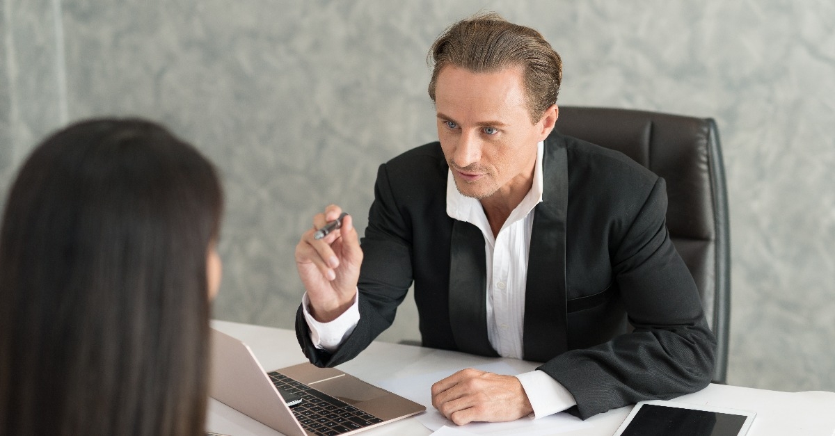 boss complains to businesswoman employee for mistake on her job