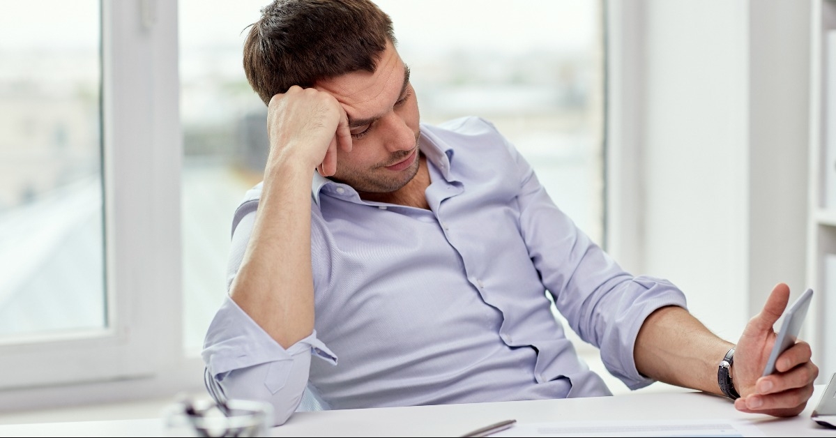 businessman with smartphone at office