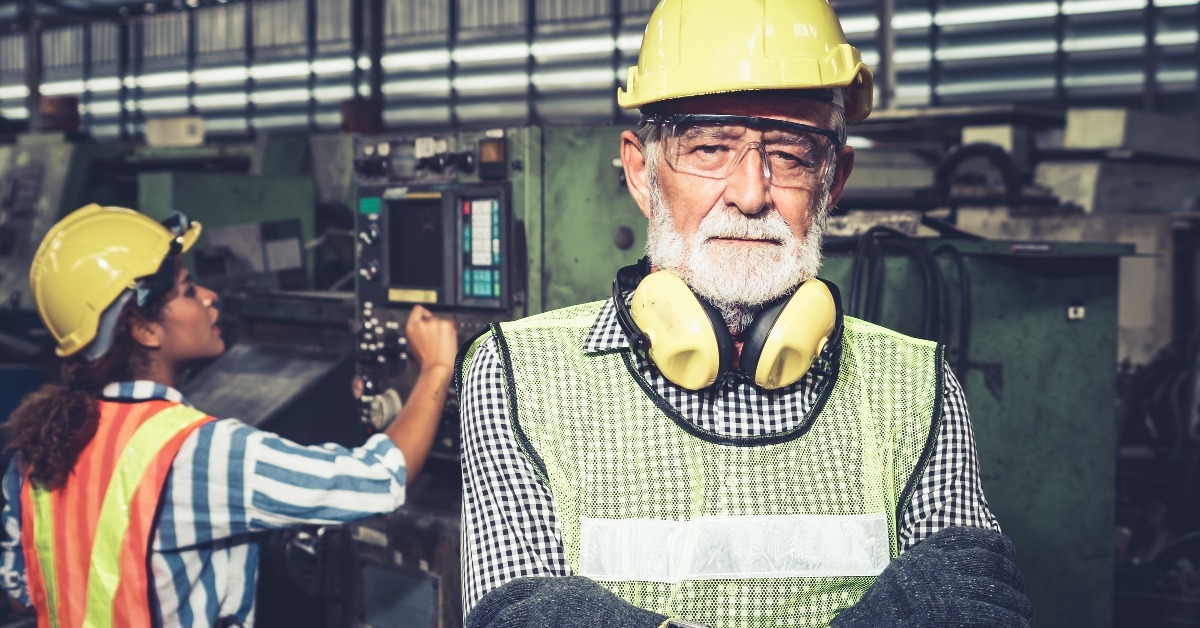 senior engineer wearing a hardhat and safety vest