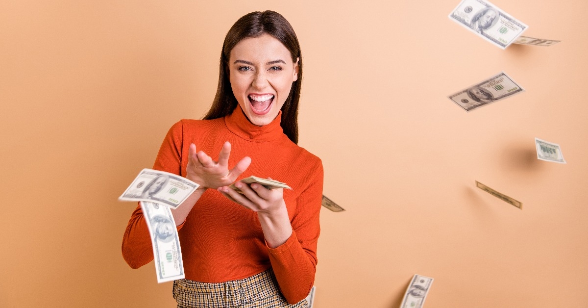  confident straight-haired girl throwing money 