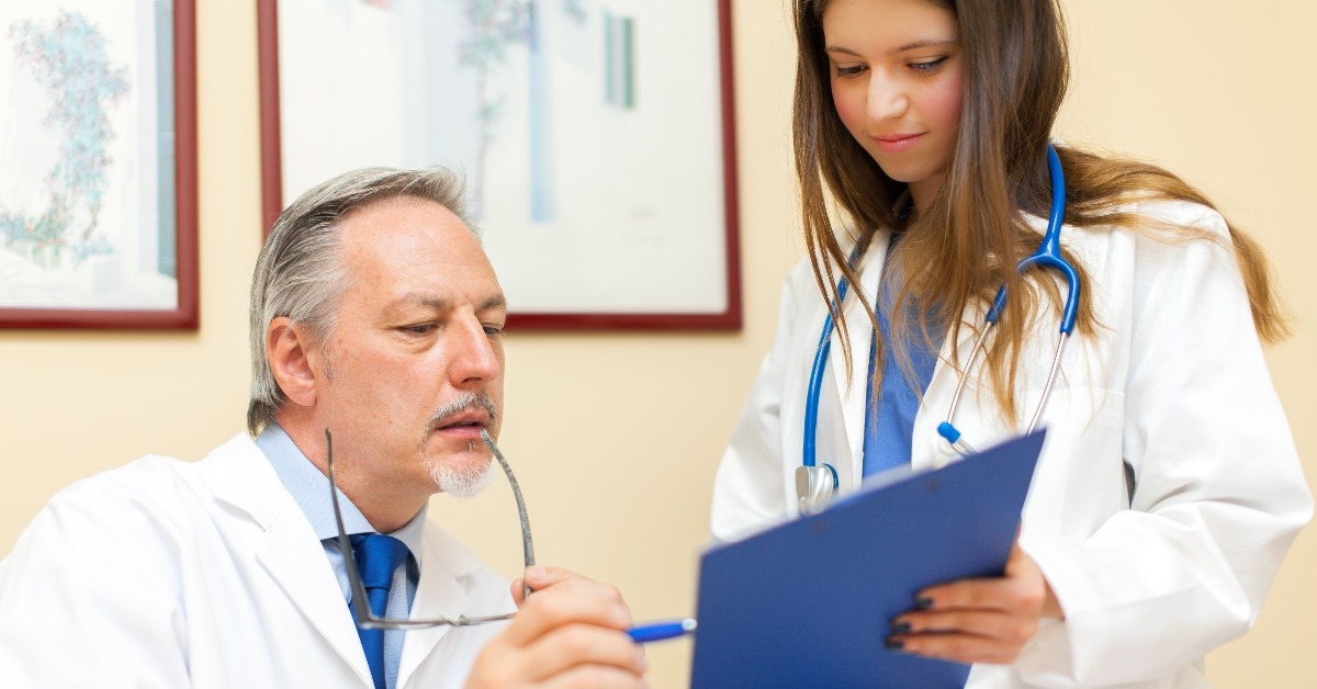 doctor and his assistant in his office