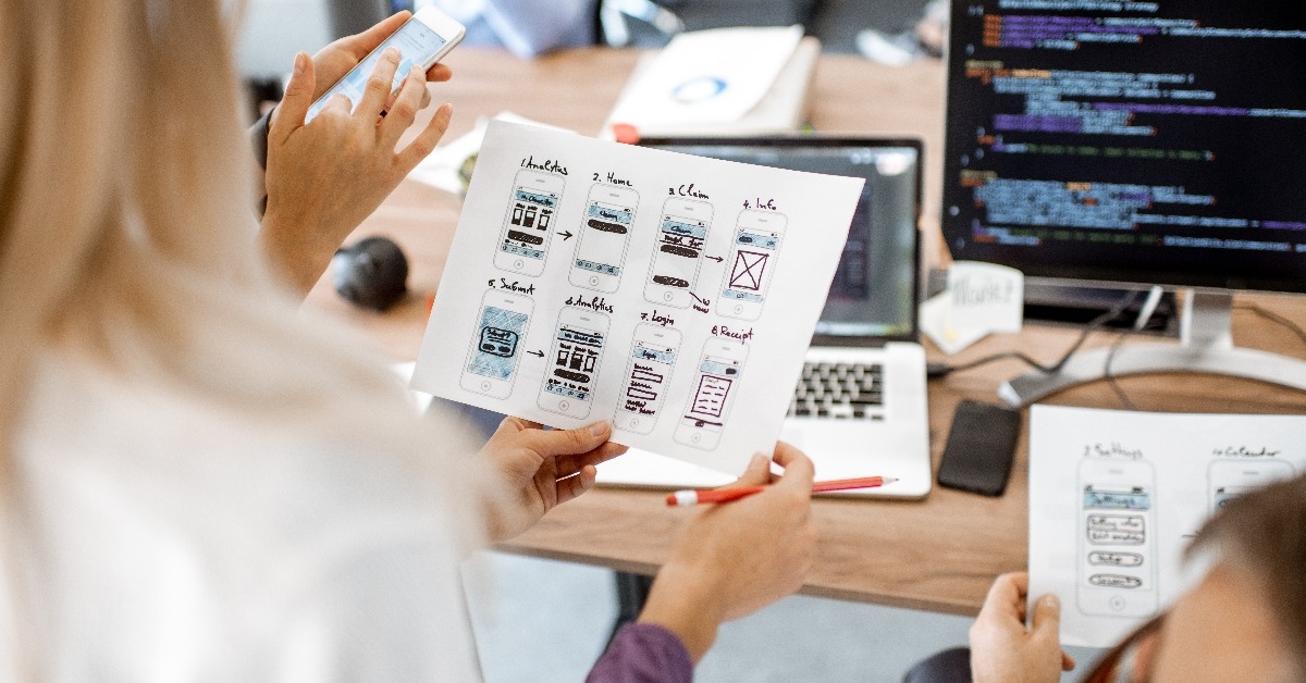 web designers developing mobile application in the office