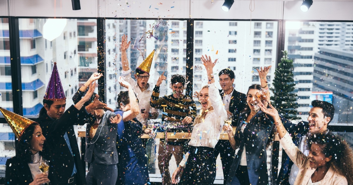 employees celebrating victory in office