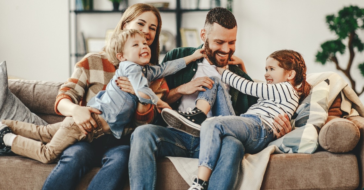 happy family at home on couch