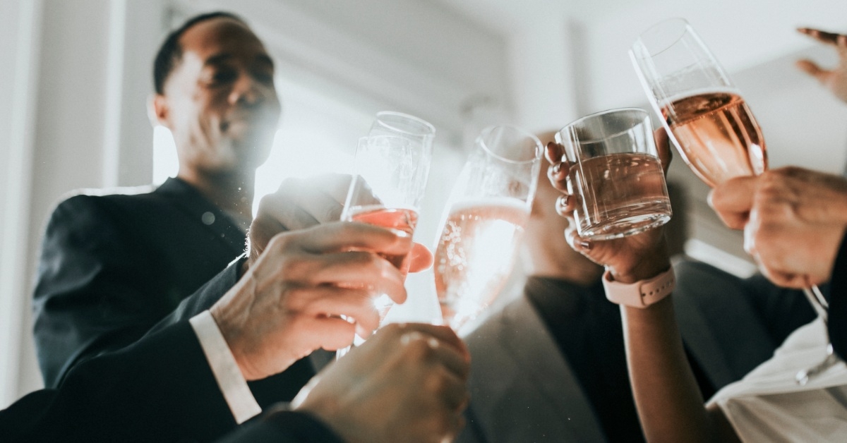 employees cheering with champagne glasses
