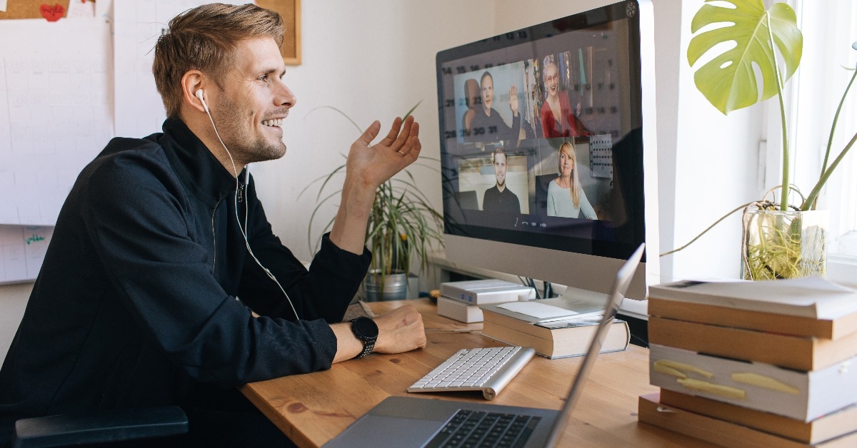 man having Zoom video call via a computer in the home office
