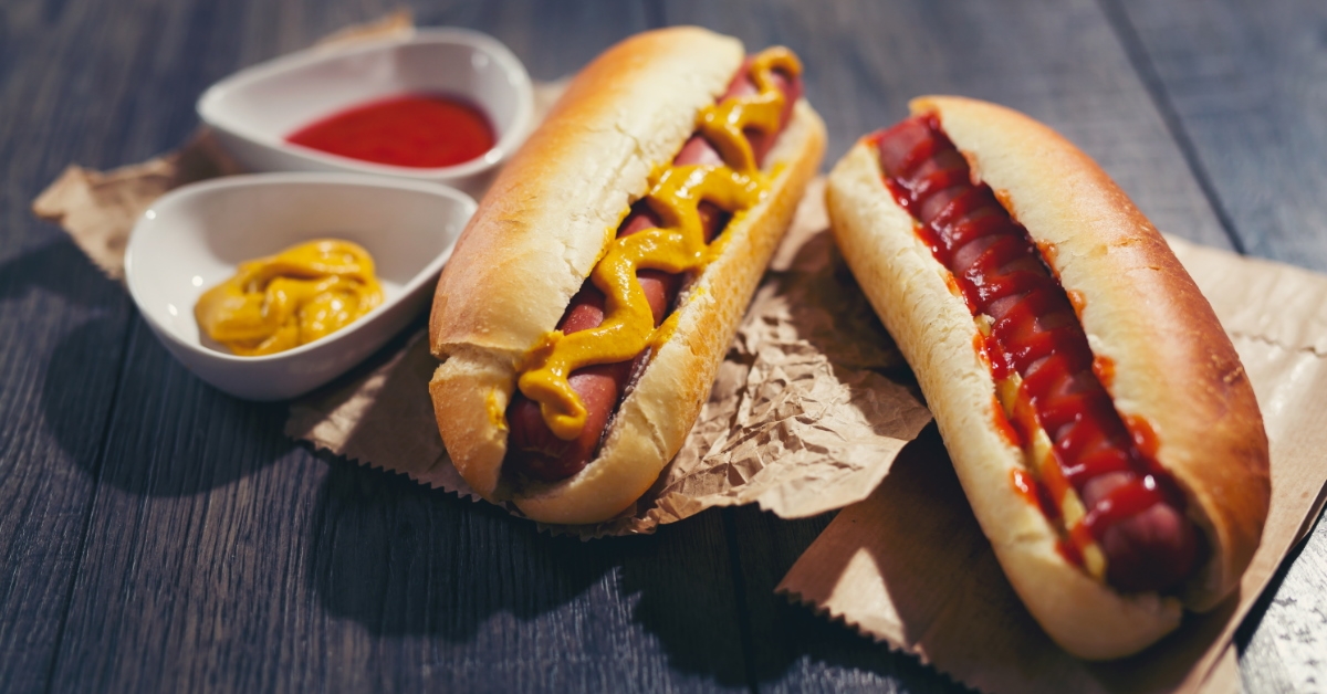 two hot dogs on wooden table