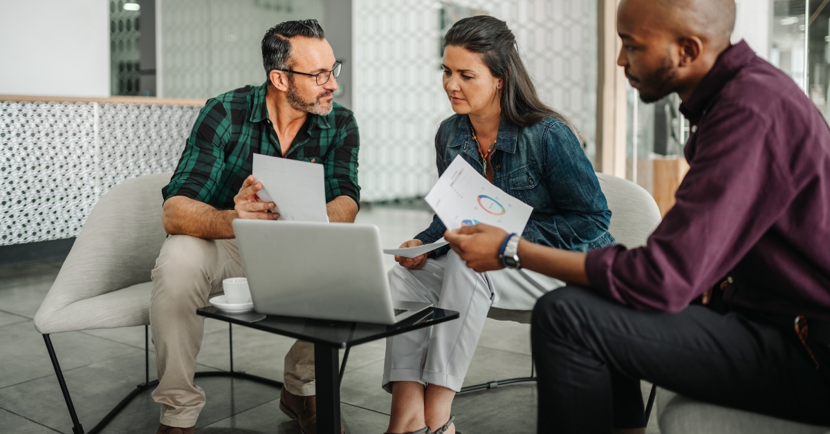 casual meeting of diverse business team analyzing financial data