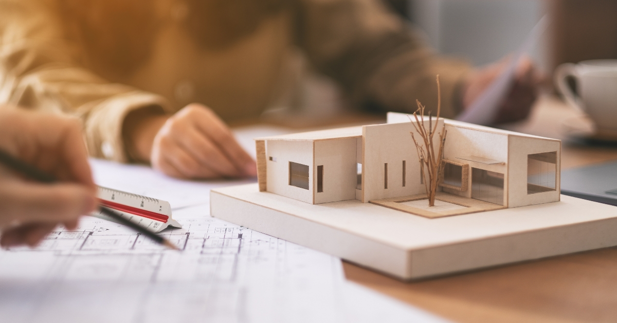 architect working and discussing about an architecture model