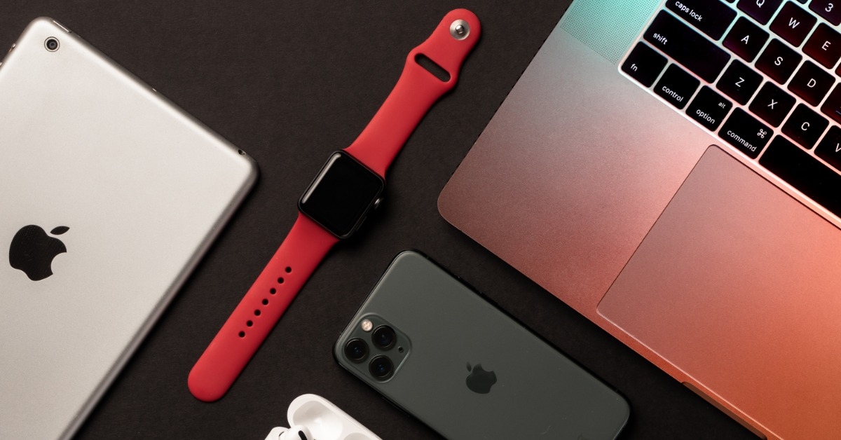 various apple products on black table