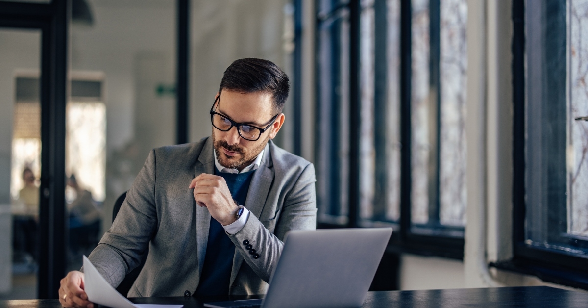 banker checking the insurance policy of his client
