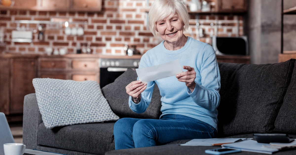 joyful pensioner keeping smile