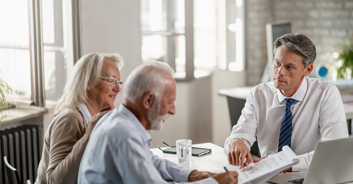 financial advisor meeting with senior couple 