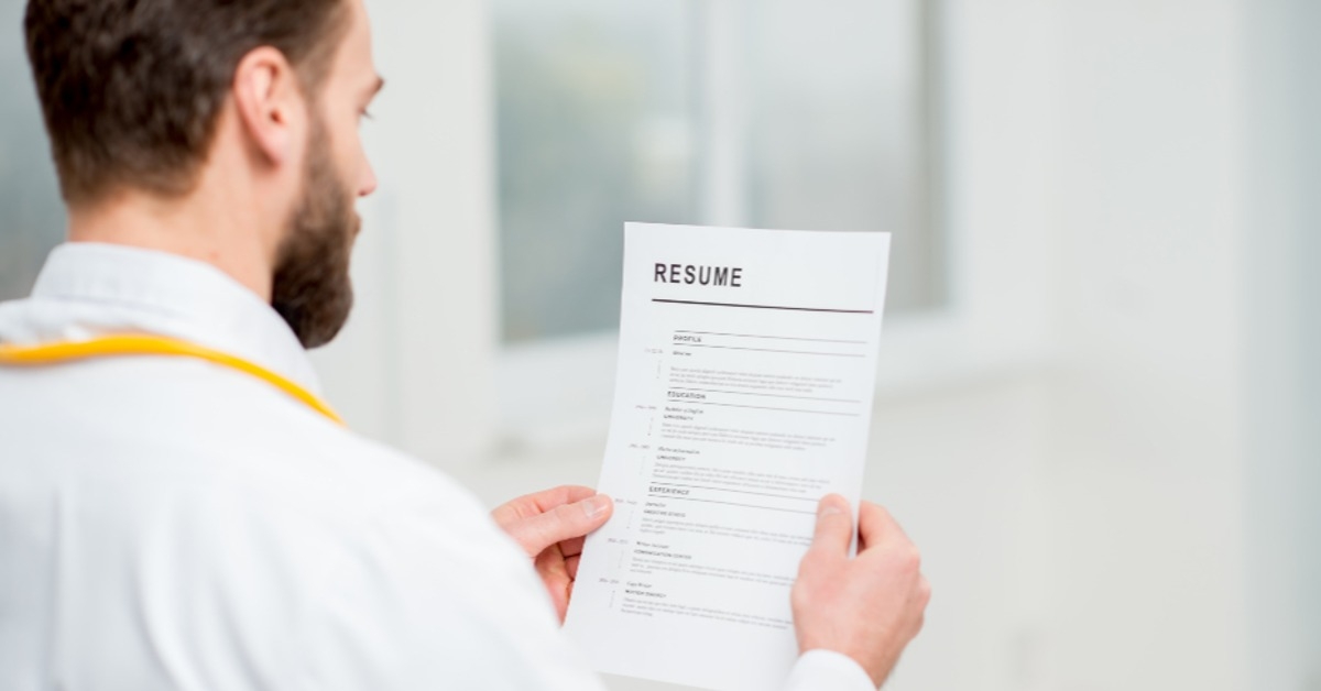 doctor reading resume for job hiring in the hospital