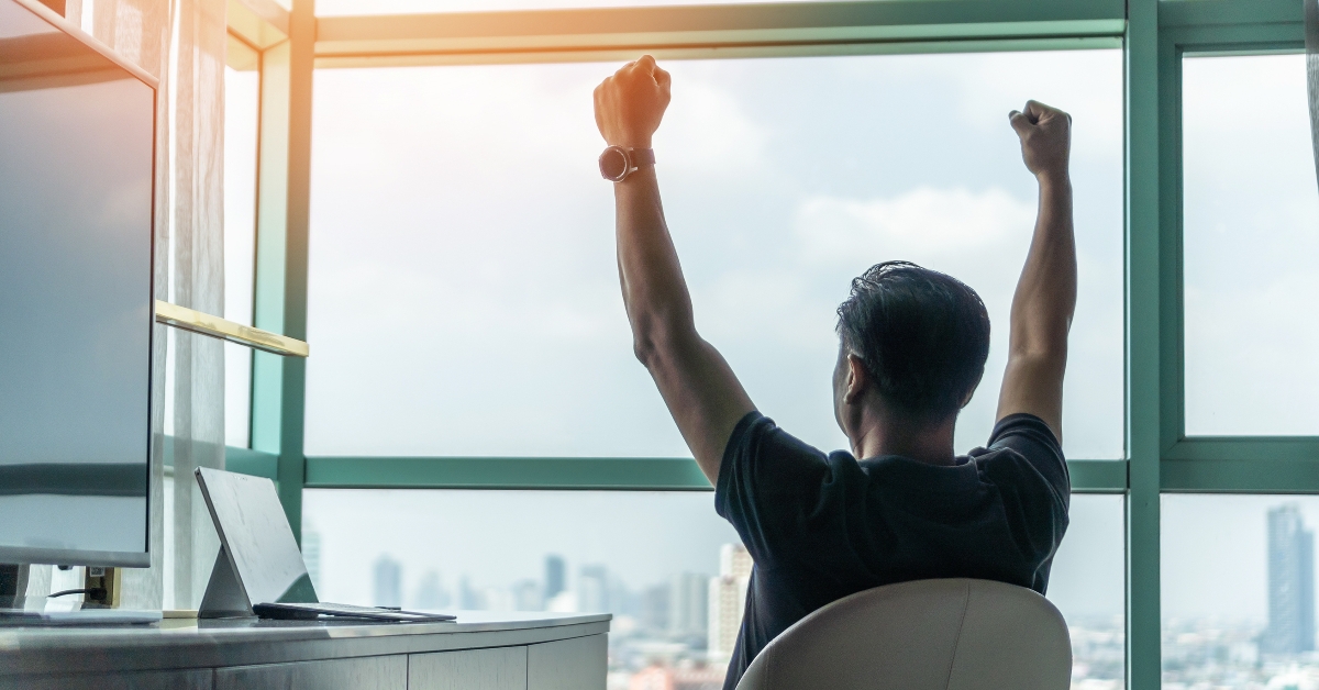 happy businessman relaxing in a hotel room