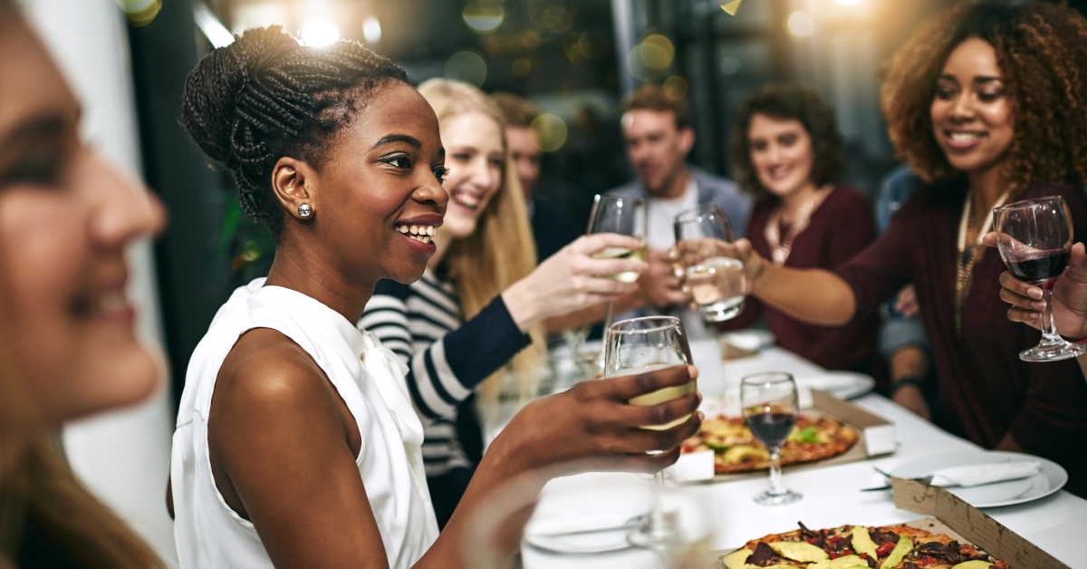 group of people toasts together at party