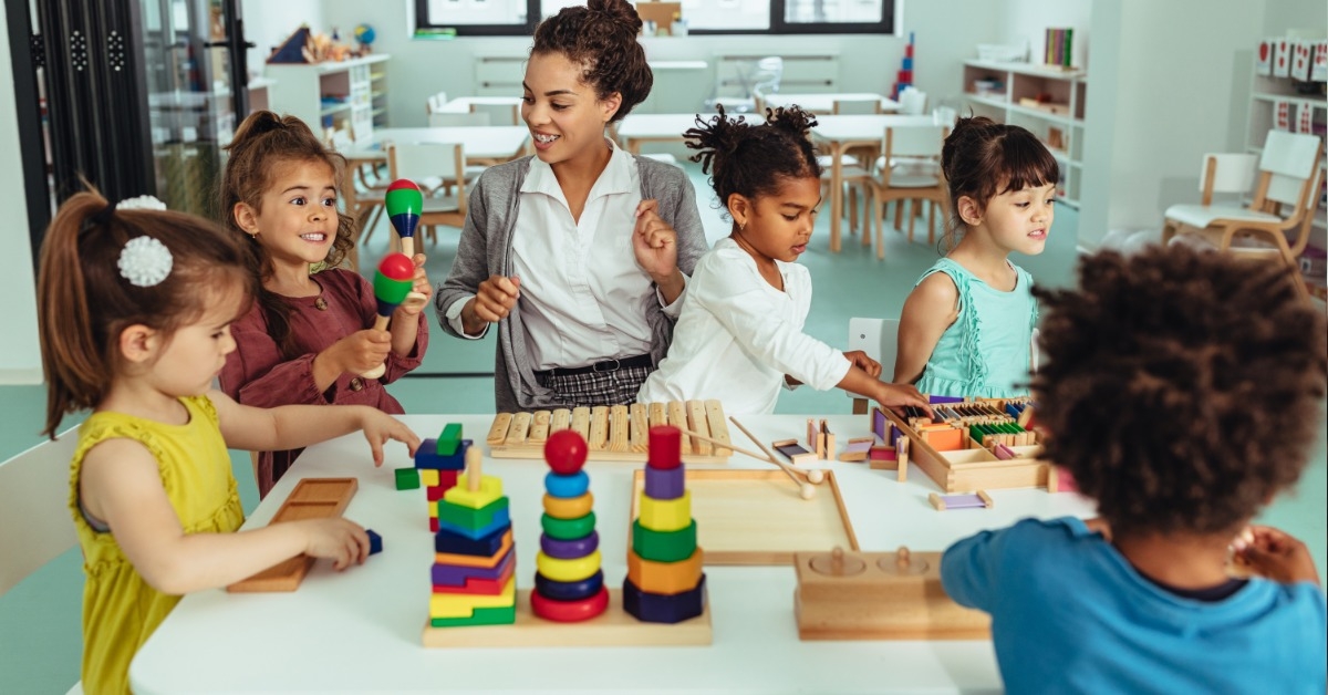 kids in classroom with young teacher