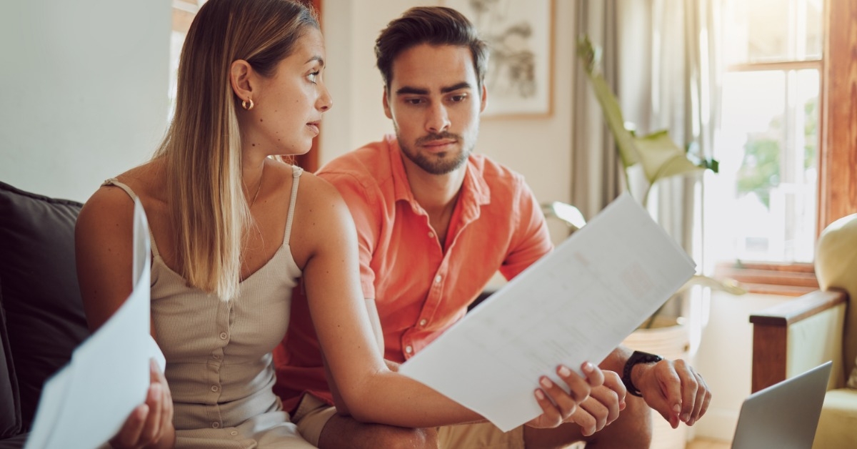 unhappy couple reviewing documents