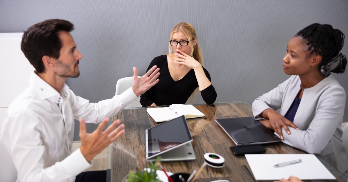 businessman discussing project sitting at office desk