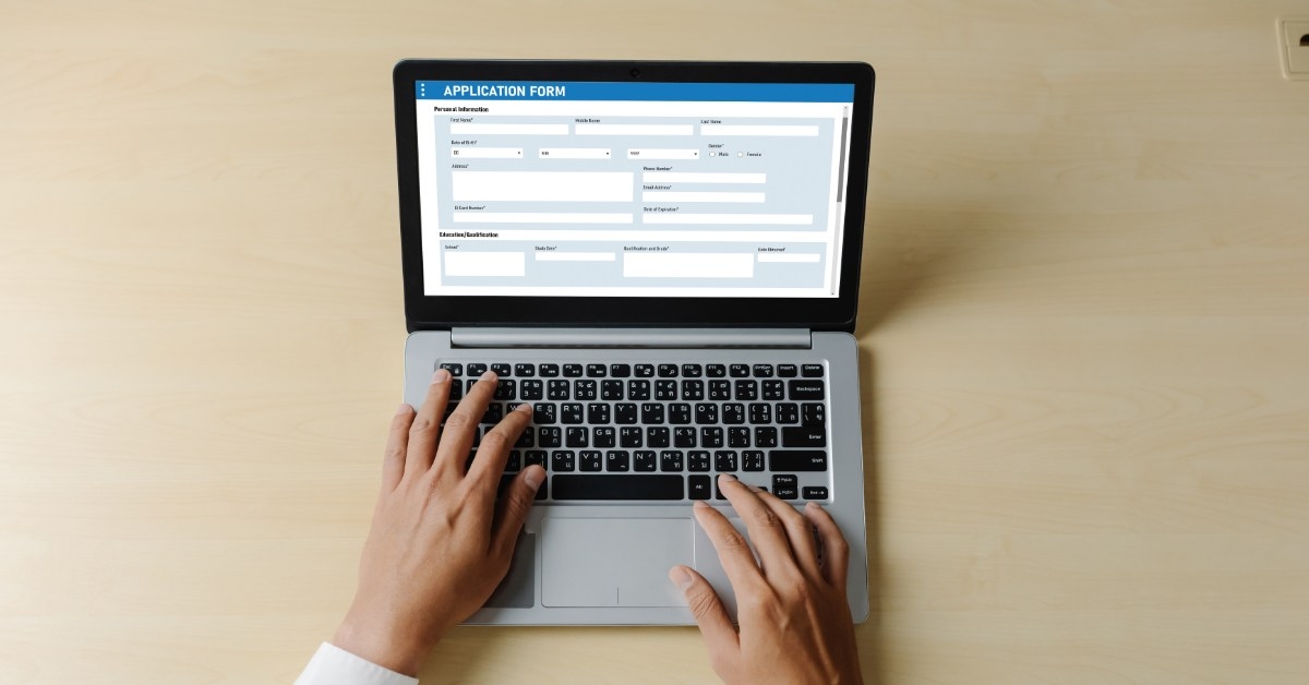 man filling modish application form on laptop