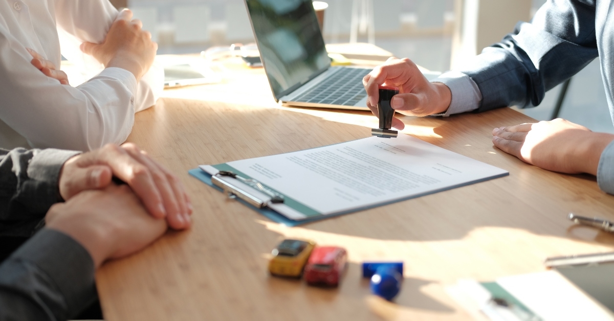 salesman uses stamper for stamping approved on mortgage loan