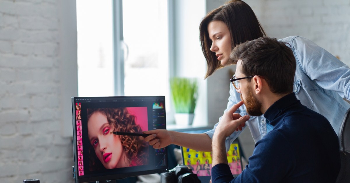 team members in office retouching picture