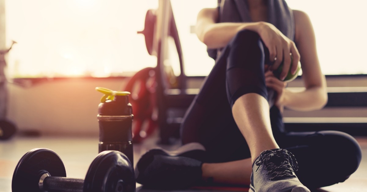 young woman working out in gym