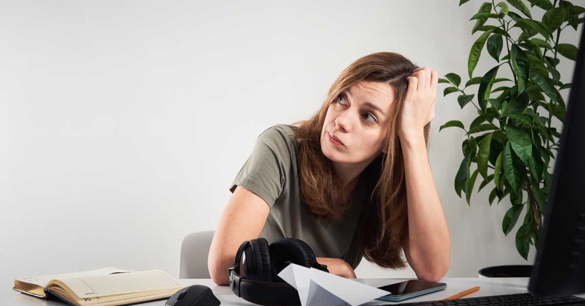woman procrastinates at home workplace