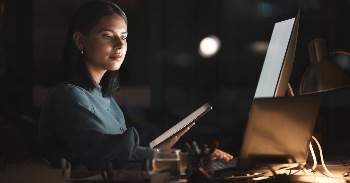 woman with tablet working on database programming code