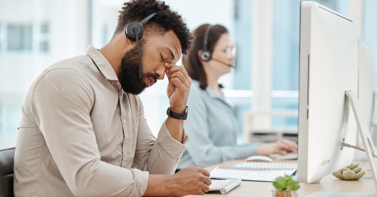 stressful african american employee in workplace 