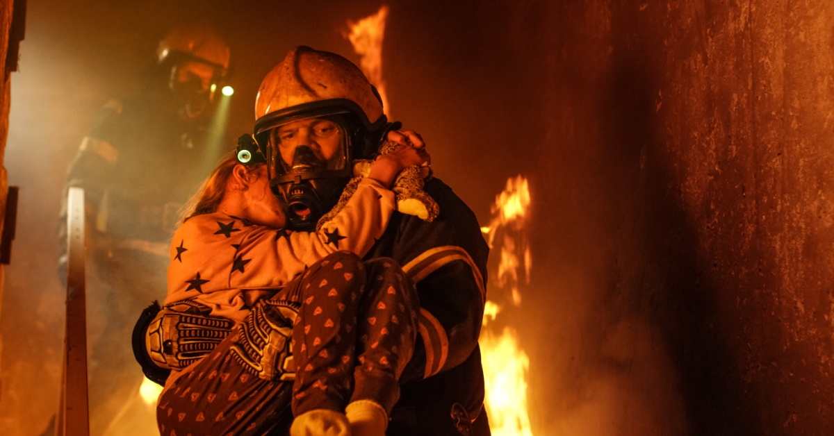 fireman rescuing girl from fire 