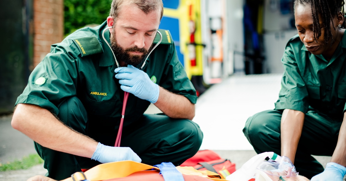 paramedics team trying to rescue man on  stretcher