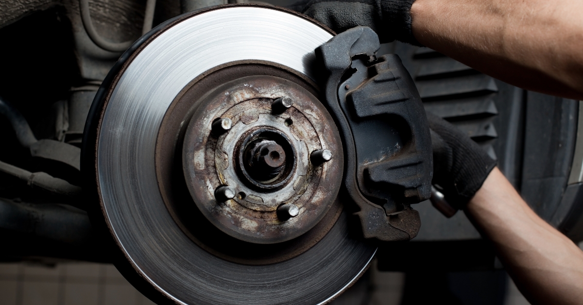 car mechanic repairs brake pads