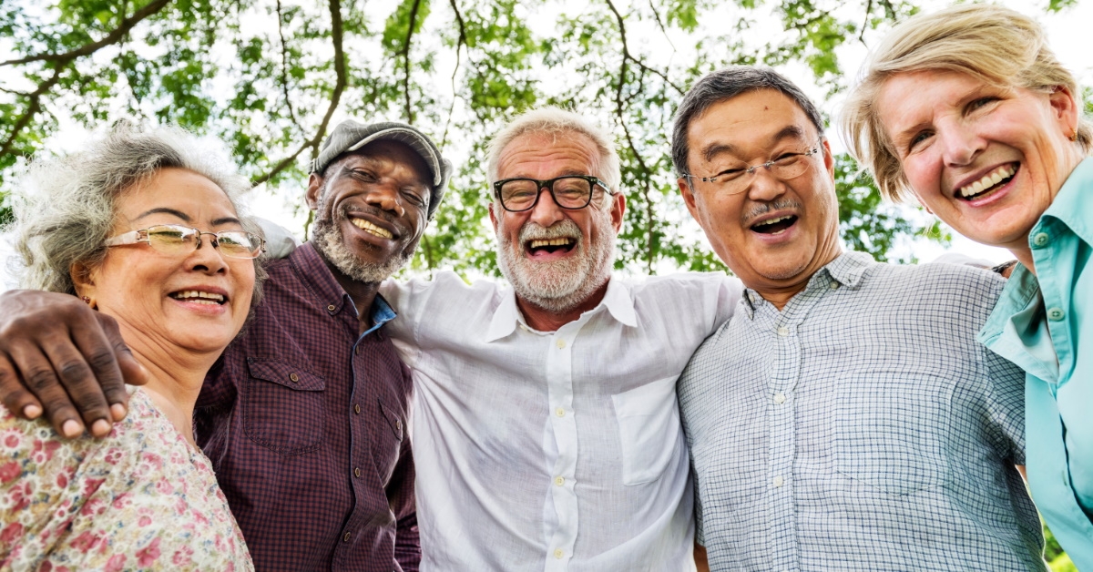 group of happy seniors hanging out 