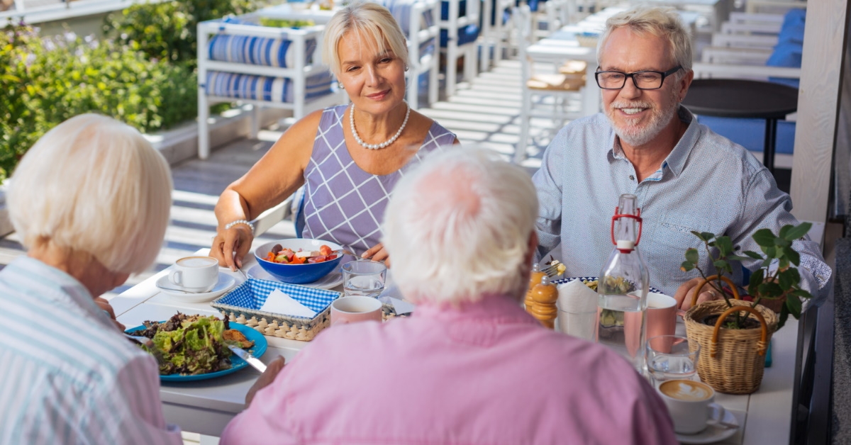senior couples enjoying food at restaurant 