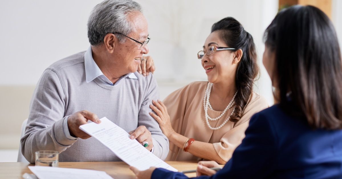 happy senior couple receiving consultation