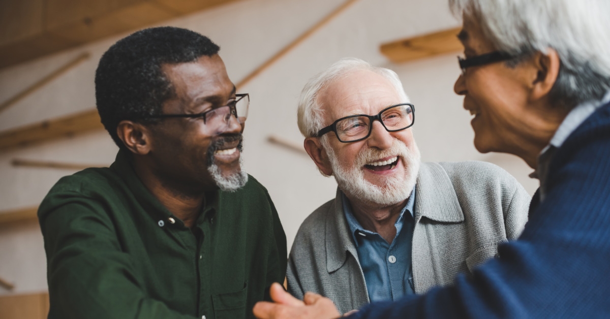 happy senior friends laughing together