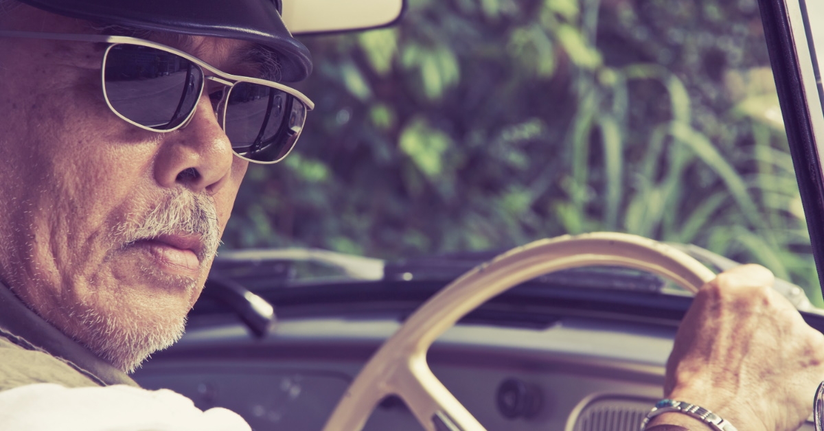 wearing sunglasses driving car