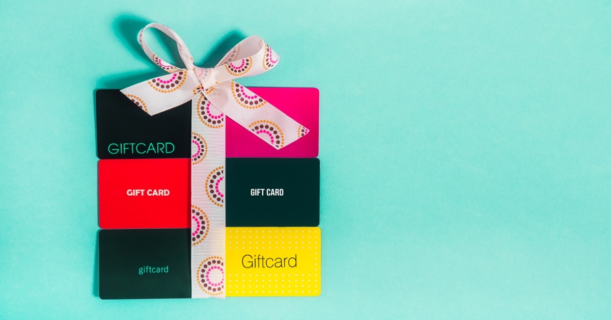 pack colorful gift cards on turquoise background
