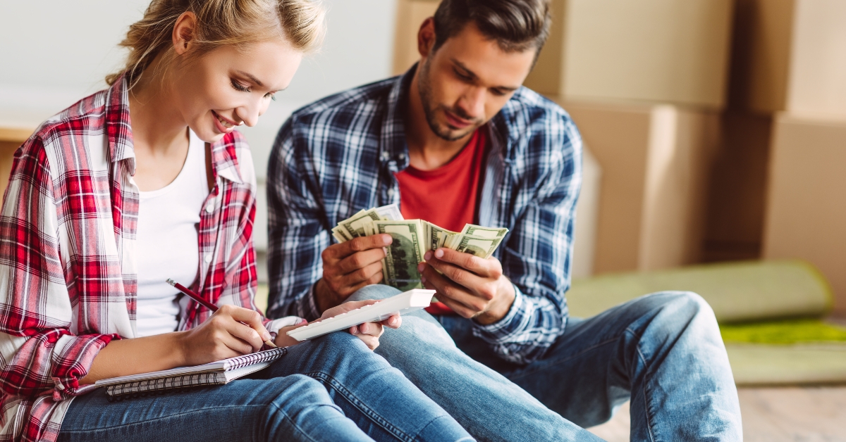 young couple counting money