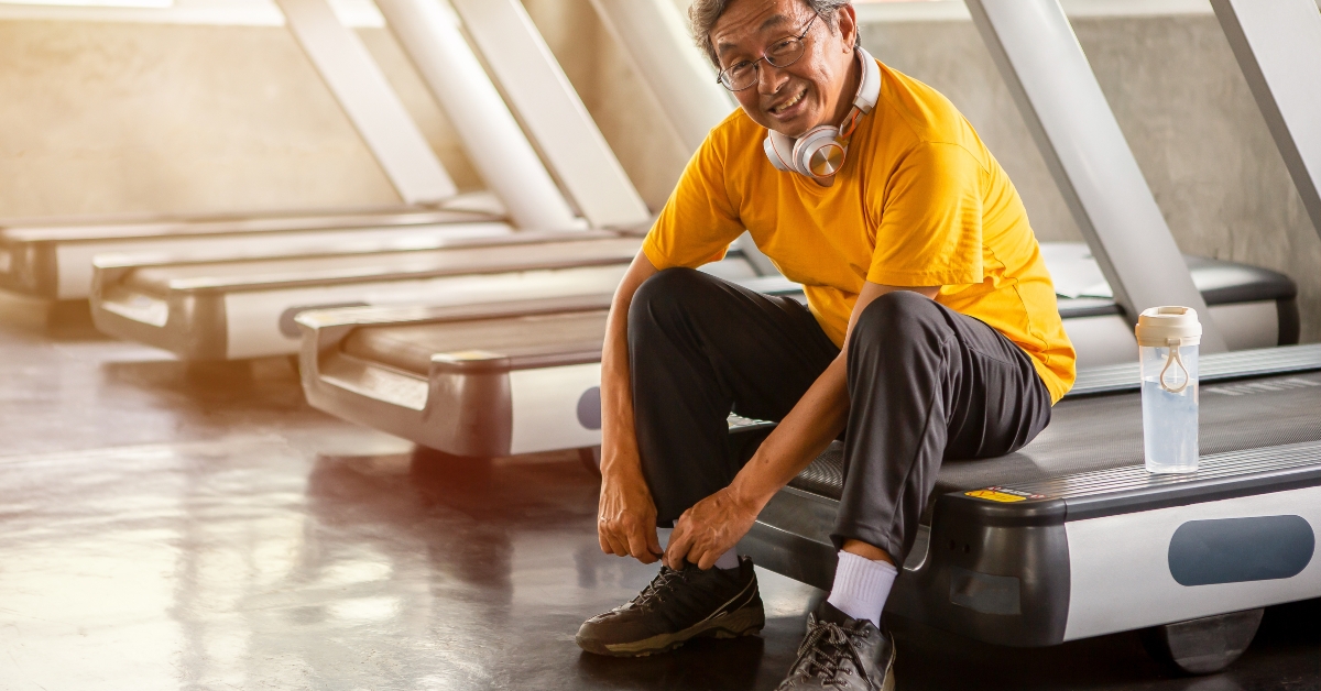man tying shoelaces on treadmill