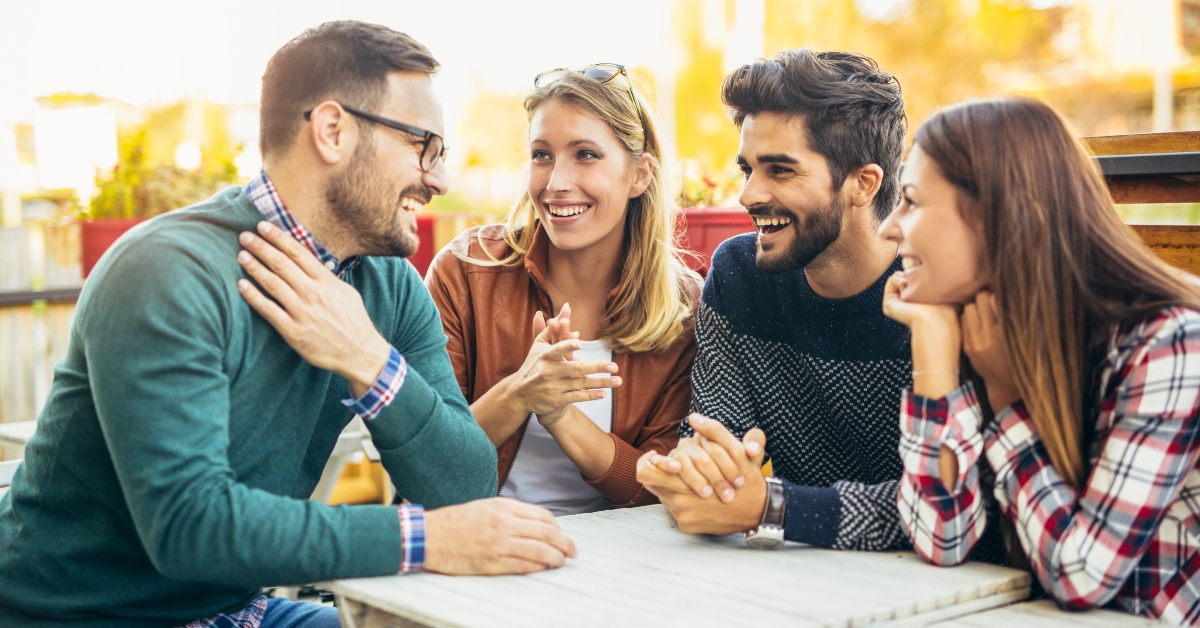 group of four friends having fun