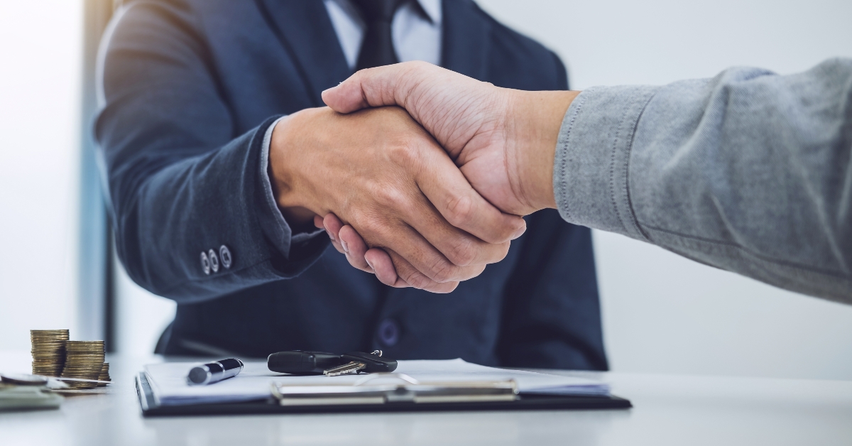 handshake of customer and salesman after agreement