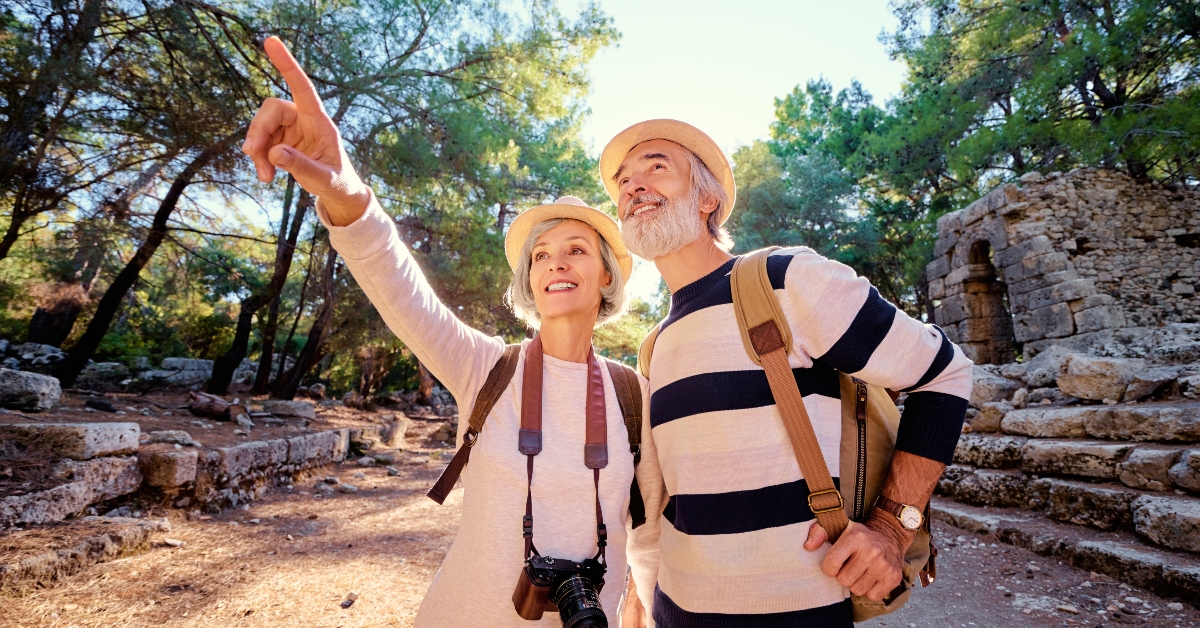 senior couple walking together on ancient sightseeing