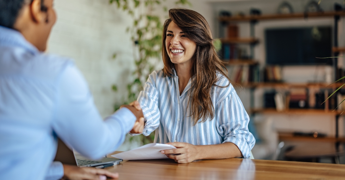happy woman getting hired for the job