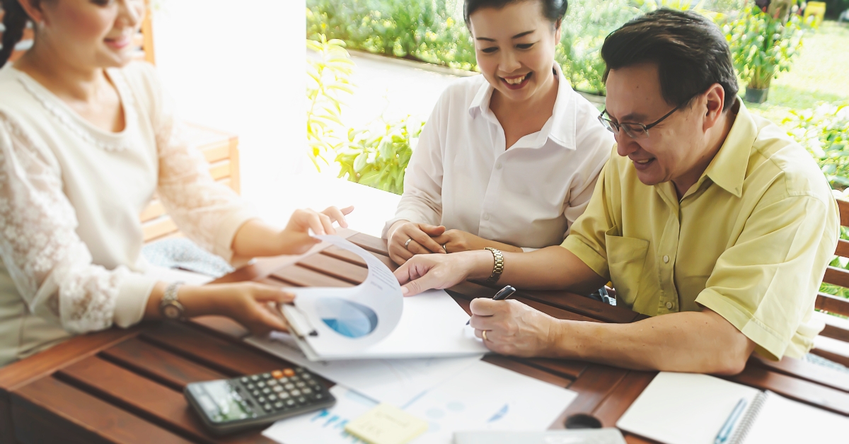 senior couple meeting financial adviser for investment