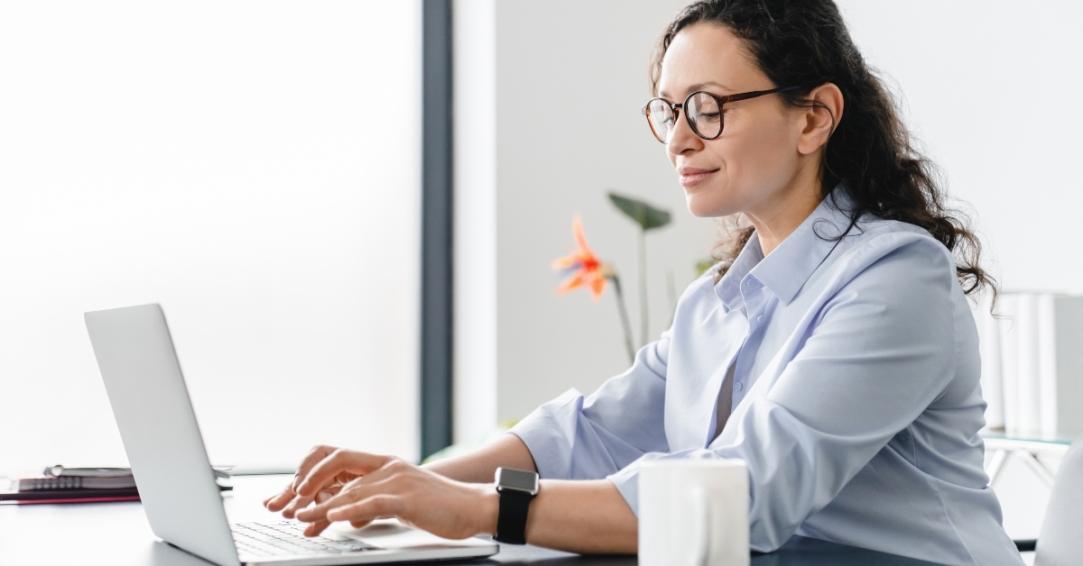 middle-aged mature businesswoman working on laptop
