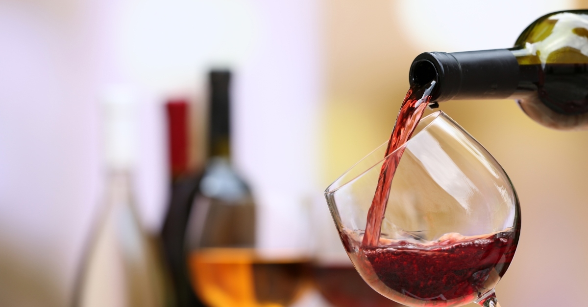 red wine pouring into wine glass