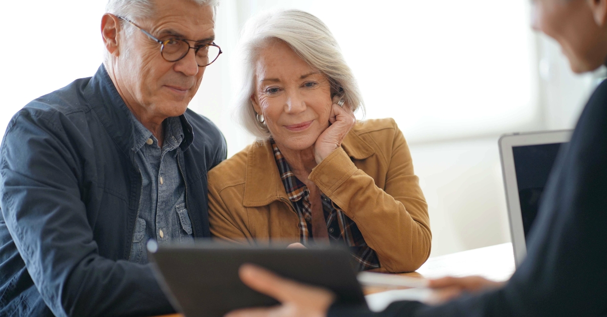 senior couple going through remodelling ideas on tablet