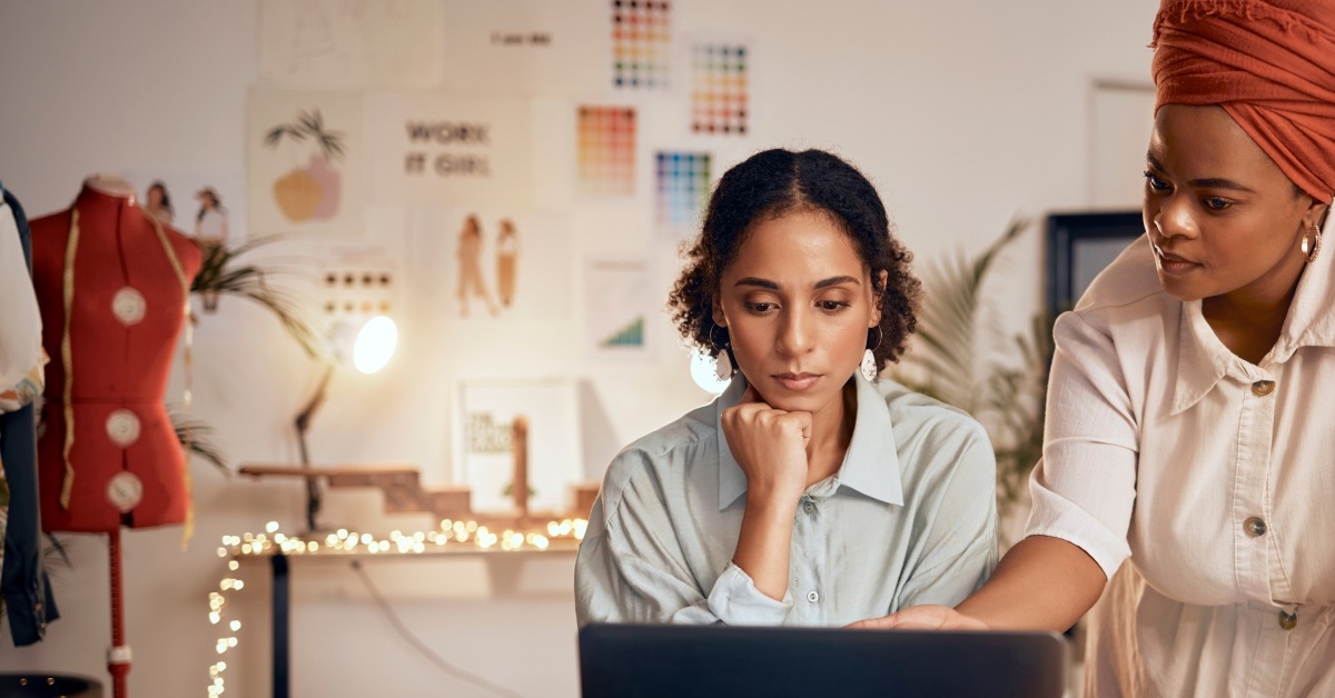 african american fashion designs working on laptop